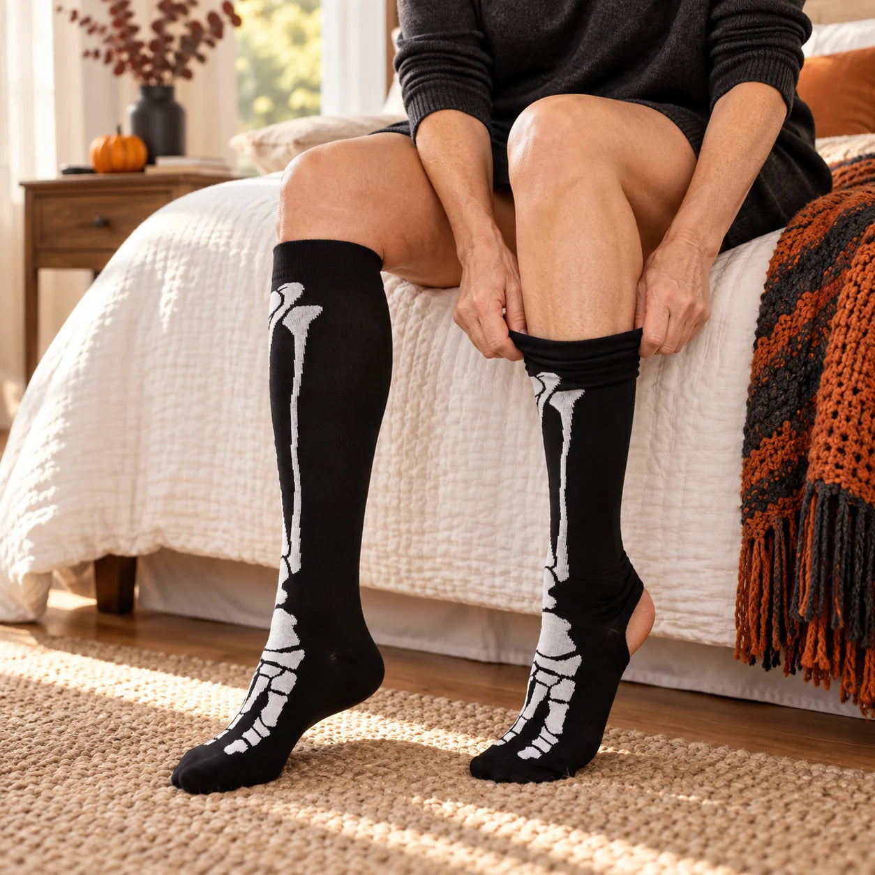 Woman putting on black full-skeleton knee-high socks